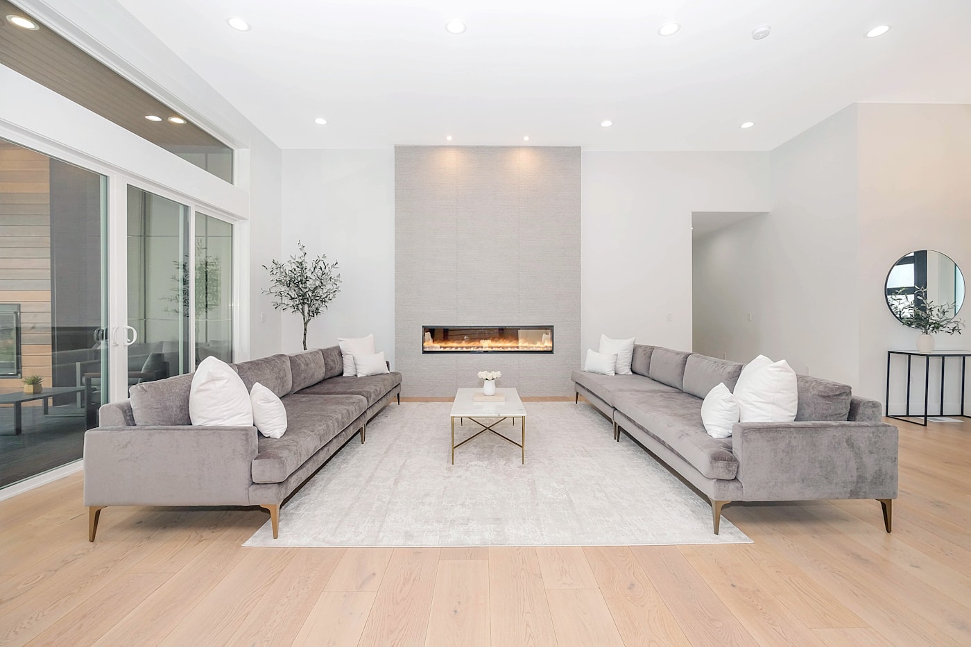 Clean modern living room with light oak flooring